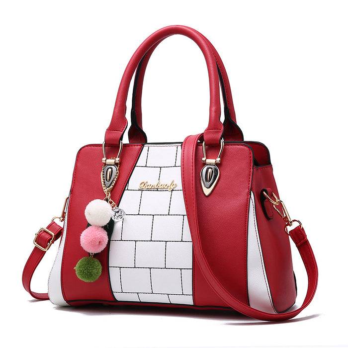Hedda | Tofarget håndveske med pompong og mange lommer